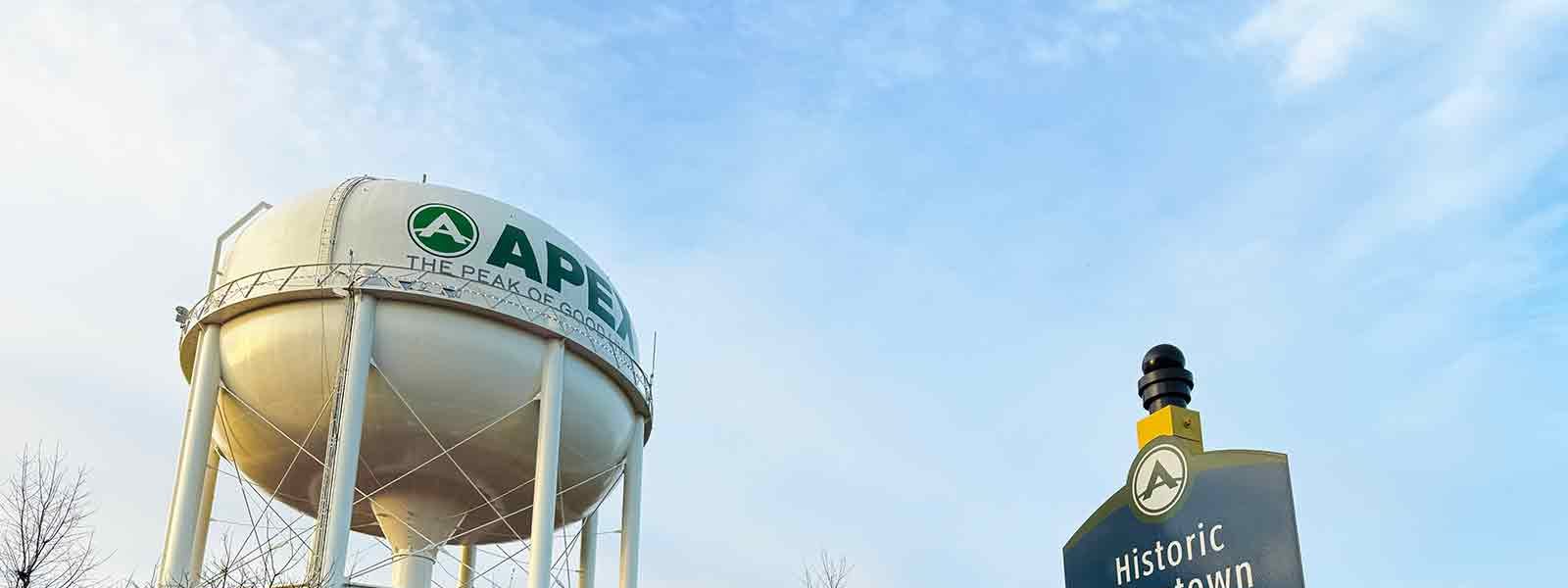The Apex water tower and a Historic Downtown sign in Apex, NC